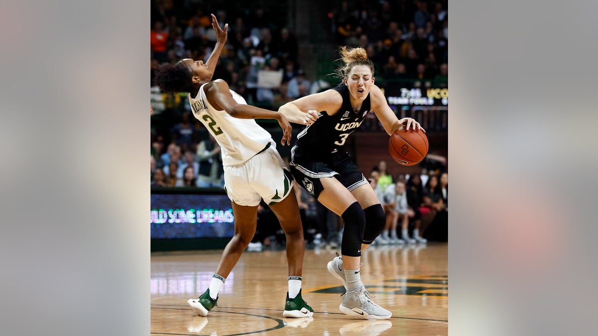 Connecticut guard/forward Katie Lou Samuelson (33) is fouled by Baylor guard Didi Richards (2) during the first half of an NCAA college basketball game on Thursday, Jan. 3, 2019, in Waco, Texas. (AP Photo/Ray Carlin)