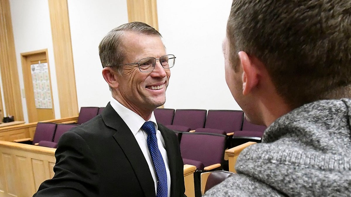 Robert Crosland smiles at son Mario Crosland after Robert was found not guilty of misdemeanor animal cruelty, Friday, Jan. 4, 2019, in Preston, Idaho. (Associated Press)