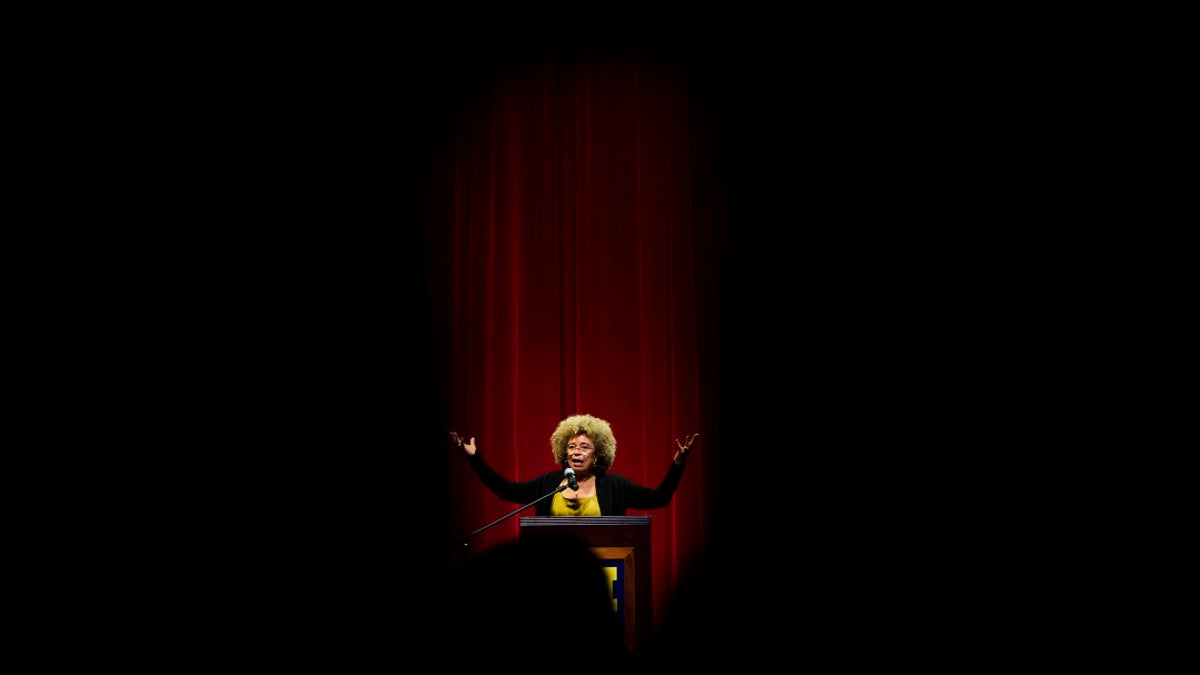 Angela Davis, author, educator and iconic civil rights activist, speaks during her visit to the University of Michigan-Flint, in Flint, Mich. (Jake May/The Flint Journal via AP, File)
