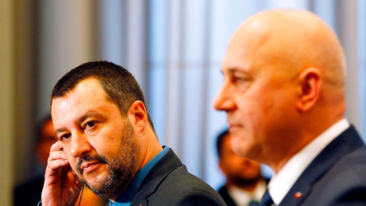 Italian Interior Minister Matteo Salvini, left, and his Polish counterpart Joachim Brudzinski, right, address the media following their talks in Warsaw, Poland, Wednesday, Jan. 9, 2019.