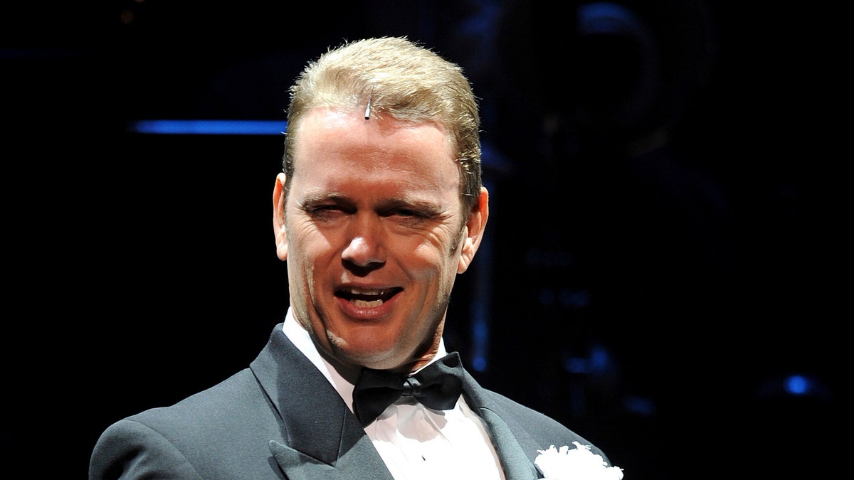 In this May 14, 2009, photo, Craig McLachlan, playing the role of Billy Flynn, performs a number in the latest production of the musical Chicago in Sydney. Australian actor McLachlan has been charged with eight counts of indecent assault, and one count of common assault, after being accused of sexual misconduct by three women who worked with him in a stage musical.