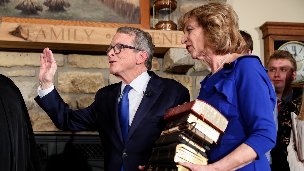 Mike DeWine is sworn in as the 70th Governor of Ohio alongside his wife Fran, Monday, Jan. 14, 2019, in Cedarville, Ohio. The former U.S. senator took his oath in a private midnight ceremony at his Cedarville home ahead of a public inauguration Monday at the Statehouse.