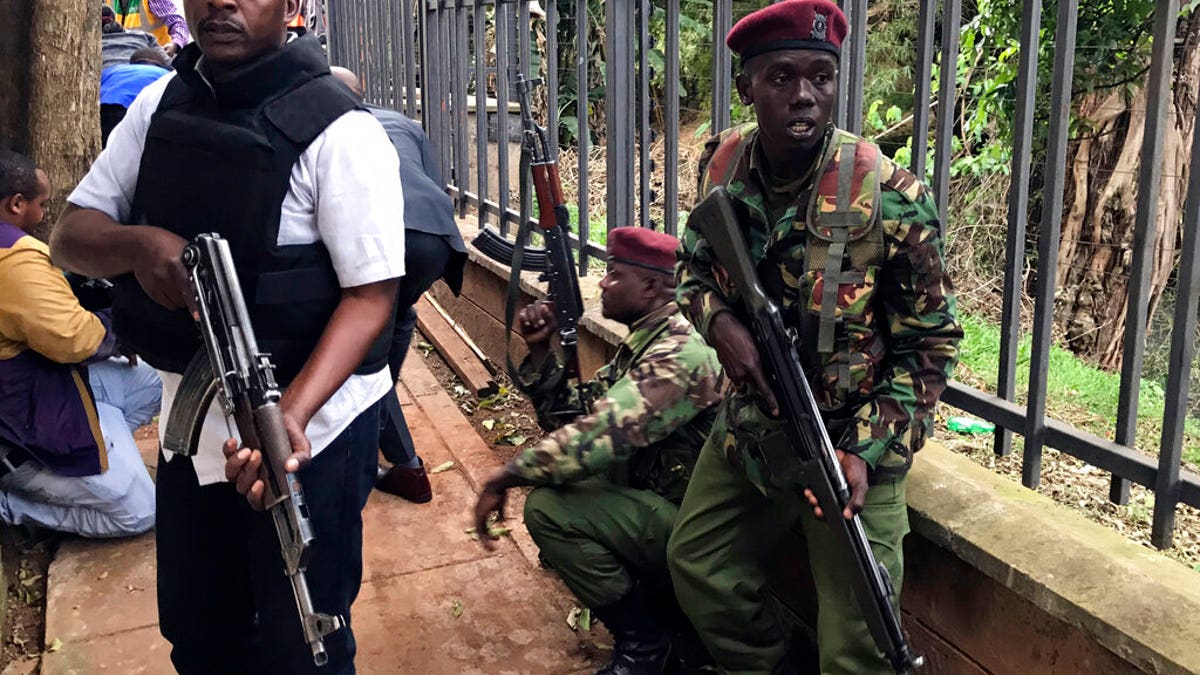 Security forces are seen at the scene of a blast in Nairobi.