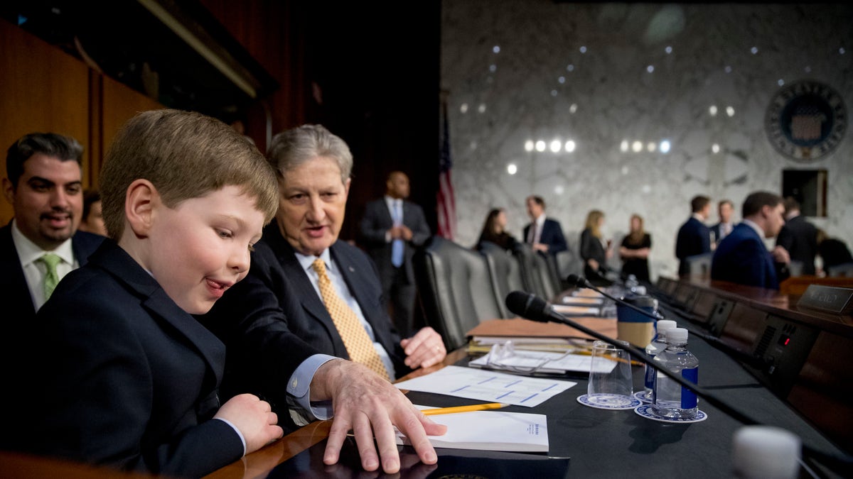 Sen. John Kennedy, R-La., brings up attorney general nominee William Barr's grandson Liam to sit with him before a Senate Judiciary Committee hearing.