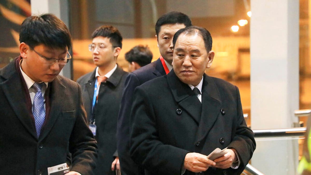 North Korean official Kim Yong Chol, right, preparing to leave the Beijing International Airport on Thursday. (Kyodo News via AP)
