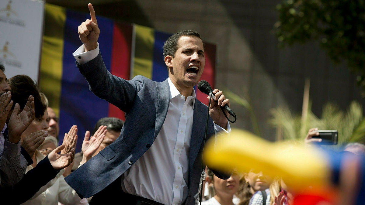 In this Jan. 11, 2019 photo, Juan Guaido, President of the Venezuelan National Assembly delivers a speech during a public session with opposition members, at a street in Caracas, Venezuela. The head of Venezuela's opposition-run congress says that with the nation's backing he's ready to take on Nicolas Maduro's presidential powers and call new elections.