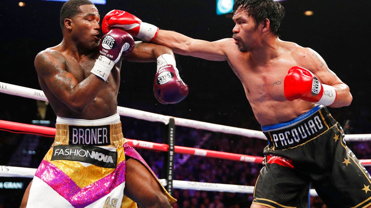 Manny Pacquiao, right, fights Adrien Broner in a welterweight championship bout in Las Vegas.