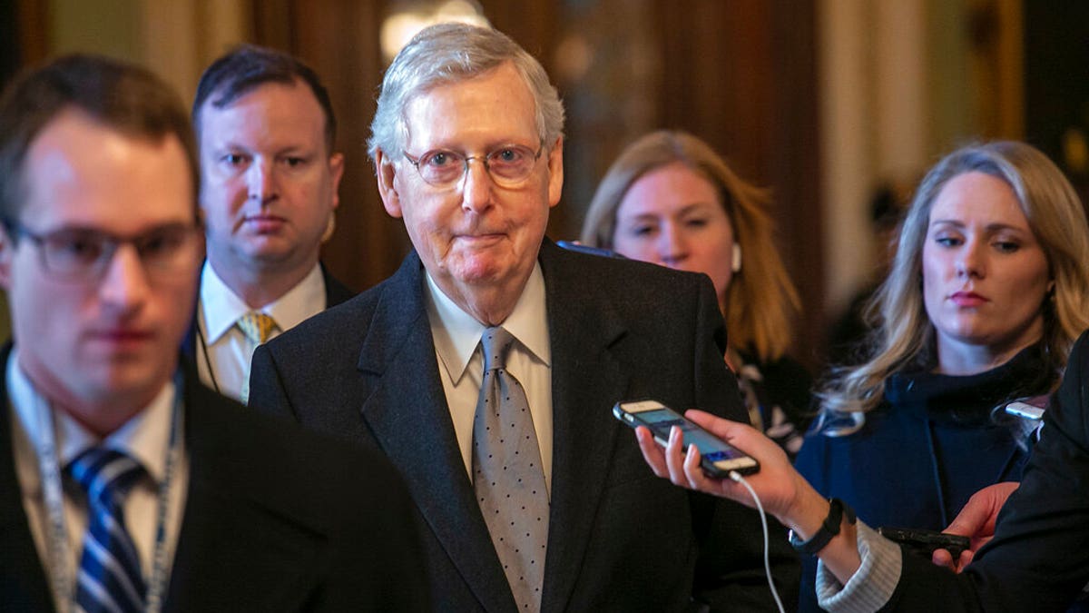 Senate Majority Leader Mitch McConnell, R-Ky., leaves the chamber after speaking about his plan to move a 1,300-page spending measure, which includes $5.7 billion to fund President Donald Trump's proposed wall along the U.S.-Mexico border, the sticking point in the standoff between Trump and Democrats that has led to a partial government shutdown, at the Capitol in Washington, Tuesday, Jan. 22, 2019. (AP Photo/J. Scott Applewhite)