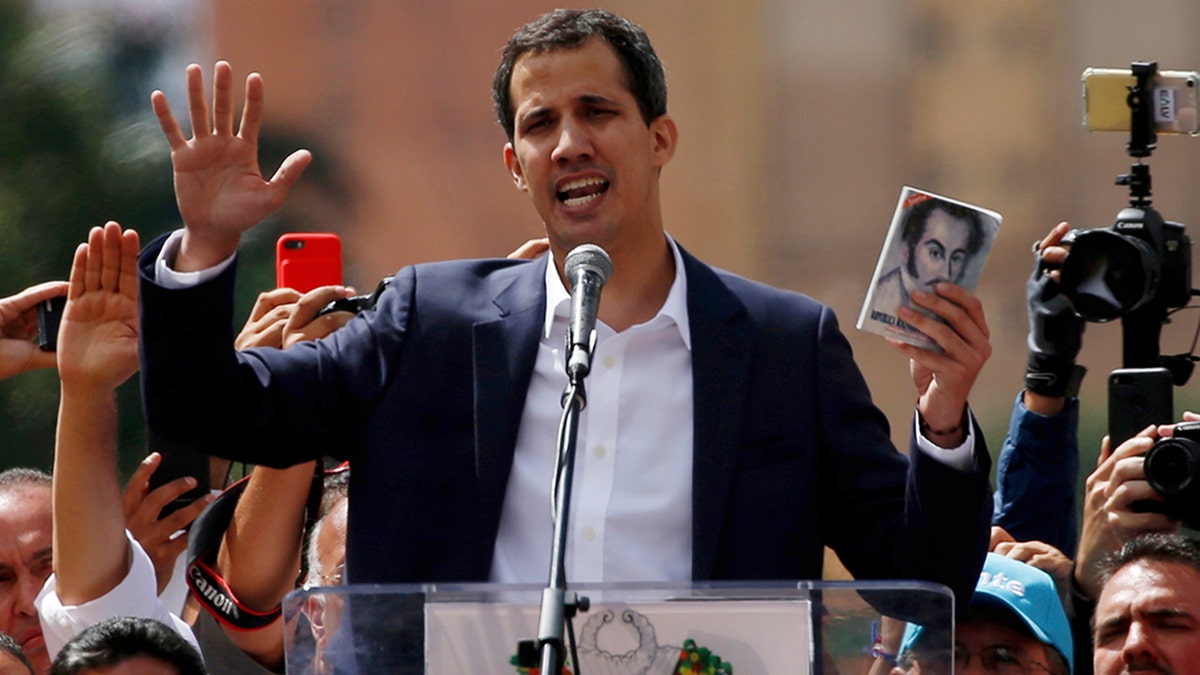 Juan Guaido, head of Venezuela's opposition-run congress, declares himself interim president of Venezuela, during a rally demanding President Nicolas Maduro's resignation in Caracas, Venezuela, Wednesday, Jan. 23, 2019. (AP Photo/Fernando Llano)