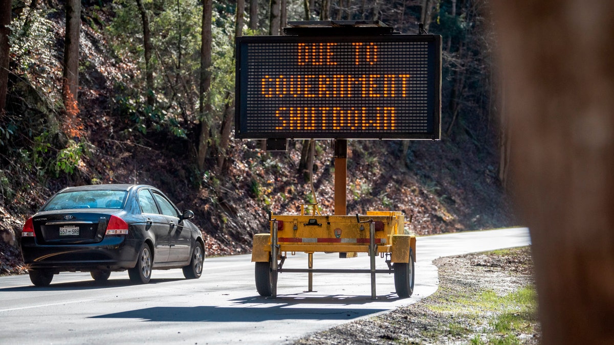 In this Saturday, Jan. 5, 2019, photo visitors to Great Smoky Mountain National Park drive through the park but facilities like the Sugarlands and Cades Cove visitor centers in Townsend, Tenn. The National Park Service said it was working on reopening all of its parks as quickly as possible, but some parks may not open immediately depending on their staff size and complexity. The Virgin Islands National Park, Cape Hatteras National Seashore, the Wright Brothers National Memorial and the Great Smoky Mountains National Park were among the parks that reopened Saturday, Jan. 26, 2019. Grand Canyon National Park issued a statement saying it would be fully operational this week.