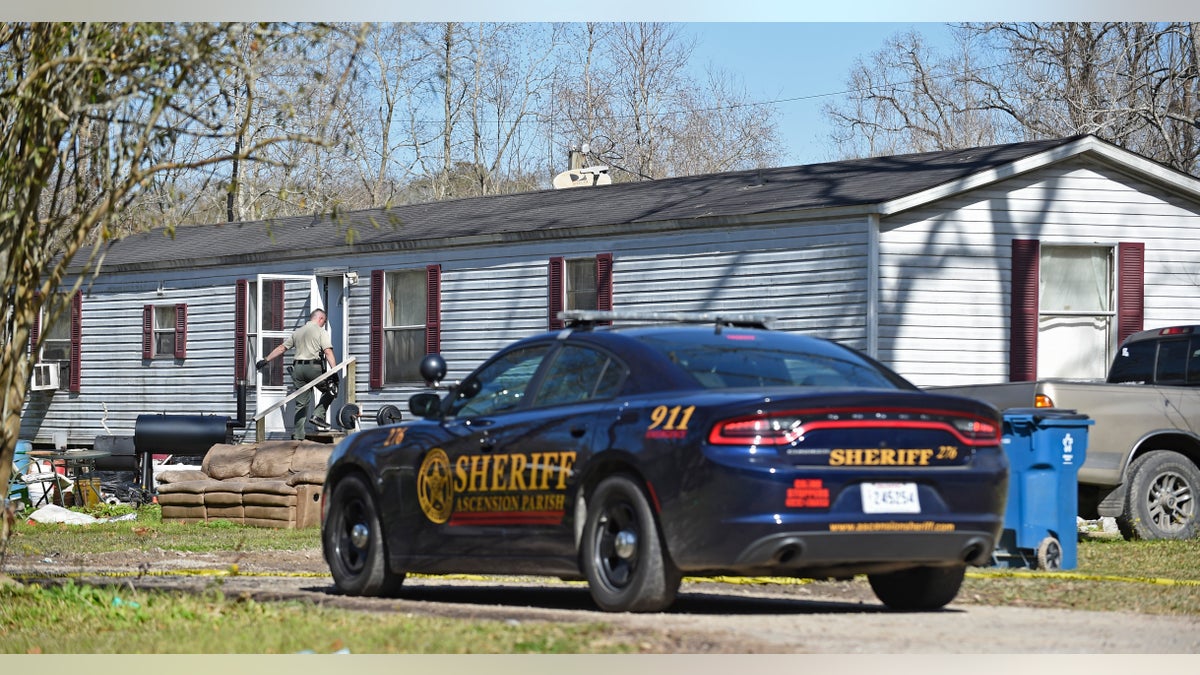 Investigators work the scene of a shooting on Saturday in Ascension Parish in Louisiana.