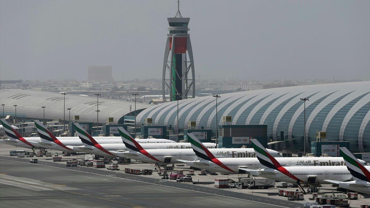 Emirates planes are parked at the Dubai International Airport in Dubai, United Arab Emirates. The airport  remains the world's busiest for international travel. (AP Photo/Kamran Jebreili, File)