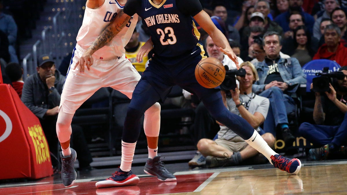 New Orleans Pelicans' Anthony Davis, right, dribbled against Los Angeles Clippers' Danilo Gallinari during the first half of an NBA basketball game in Los Angeles on Jan. 14.