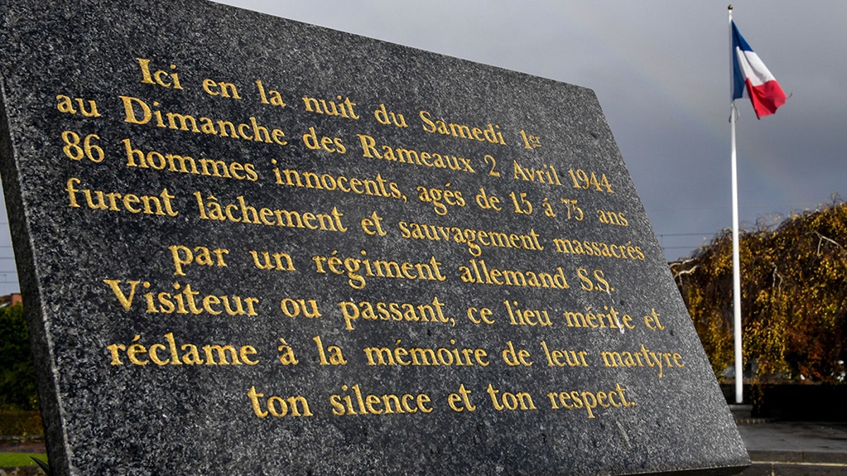 A commemorative plaque is pictured on November 13, 2017 in Villeneuve-d'Ascq, northern France, reminding of the April 2, 1944 WWII massacre of 86 civilians by a Nazi Germany regiment. After a 1949 trial that ended with the acquittal in 1955 of 17 Nazi SS officers and soldiers, victims' relatives are hoping a trial could be re-opened by Germany's legal system.