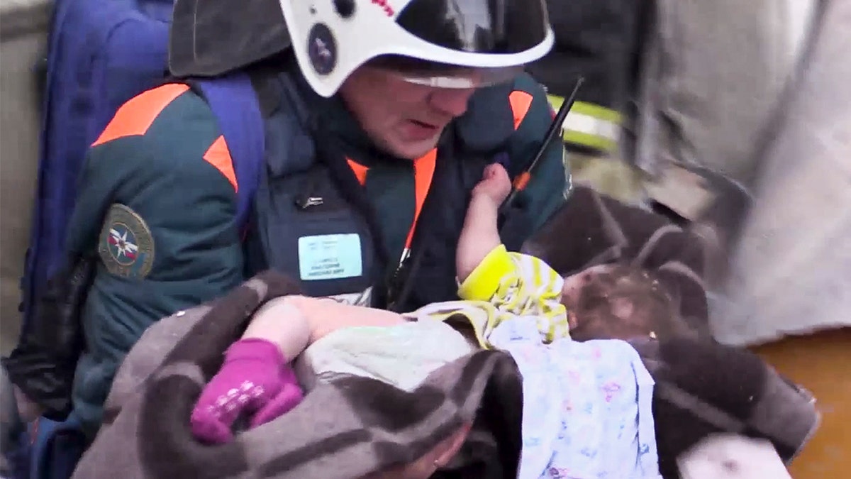 The baby girl rescued Tuesday from the rubble of a collapse building in Russia was taken to the hopspital in "grave" condition, according to the TASS news agency. (Russian Ministry for Emergency Situations photo via AP)