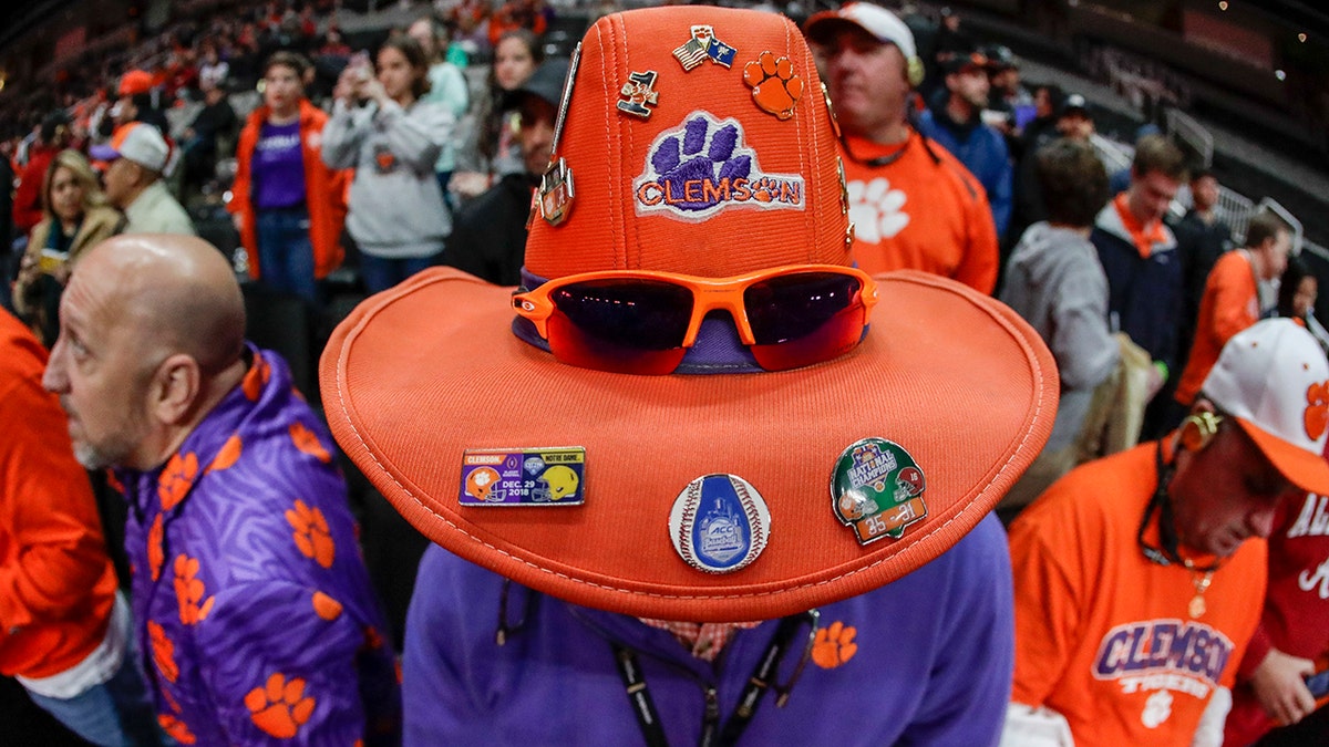 A Clemson fan watches media day for the NCAA college football playoff championship game Saturday, Jan. 5, 2019, in Santa Clara, Calif. 