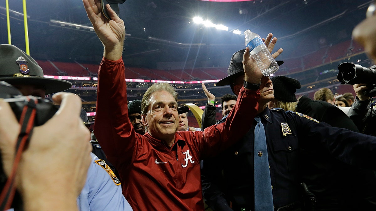 FILE - In this Jan. 8, 2018, file photo, Alabama head coach Nick Saban celebrates after overtime of the NCAA college football playoff championship game against Georgia, in Atlanta.