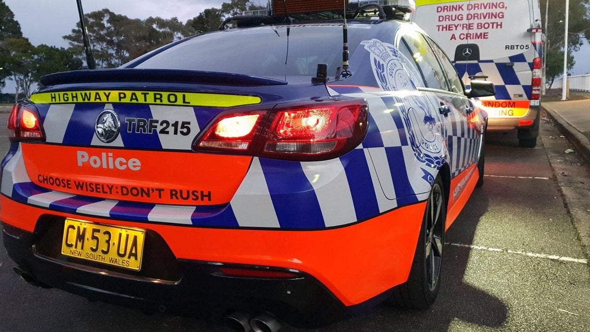 Australian authorities have arrested a teen suspect for allegedly stabbing two mean outside Sydney's Church of Scientology headquarters.