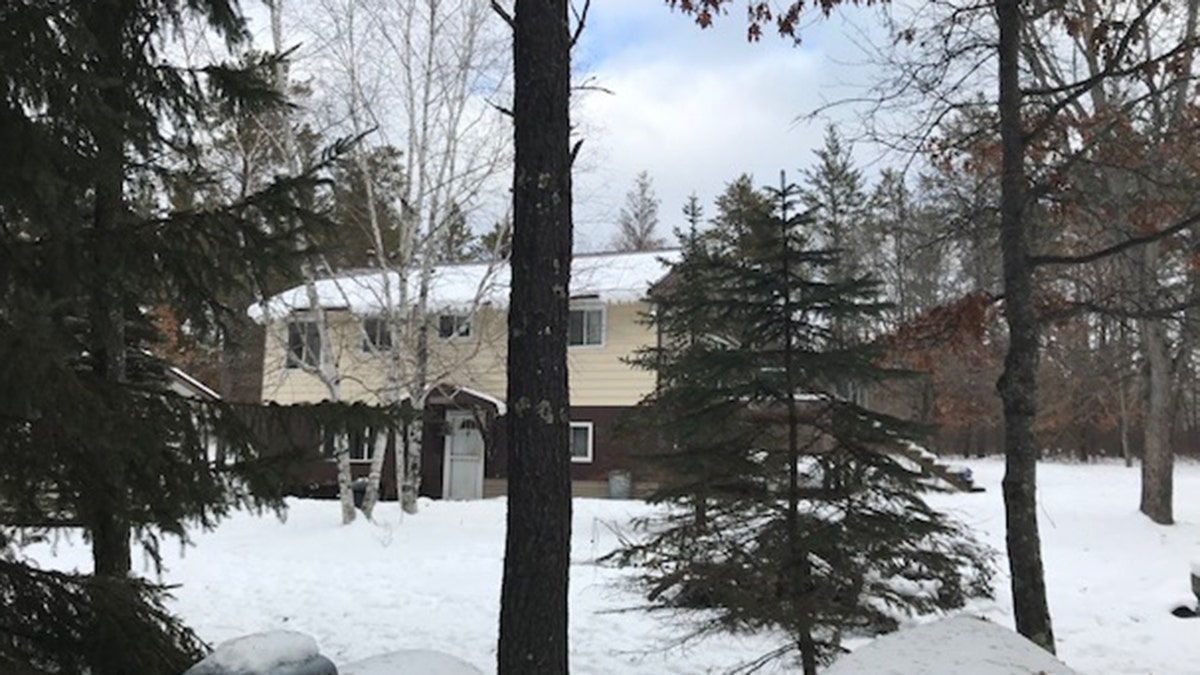 The property in Gordon, Wisc. has two structures, a a two-story house and then a two car garage