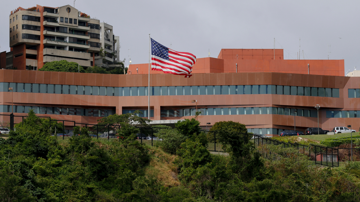 The U.S flag flies outside the U.S. embassy in Caracas, Venezuela, which remains open in the face of continuing local unrest.