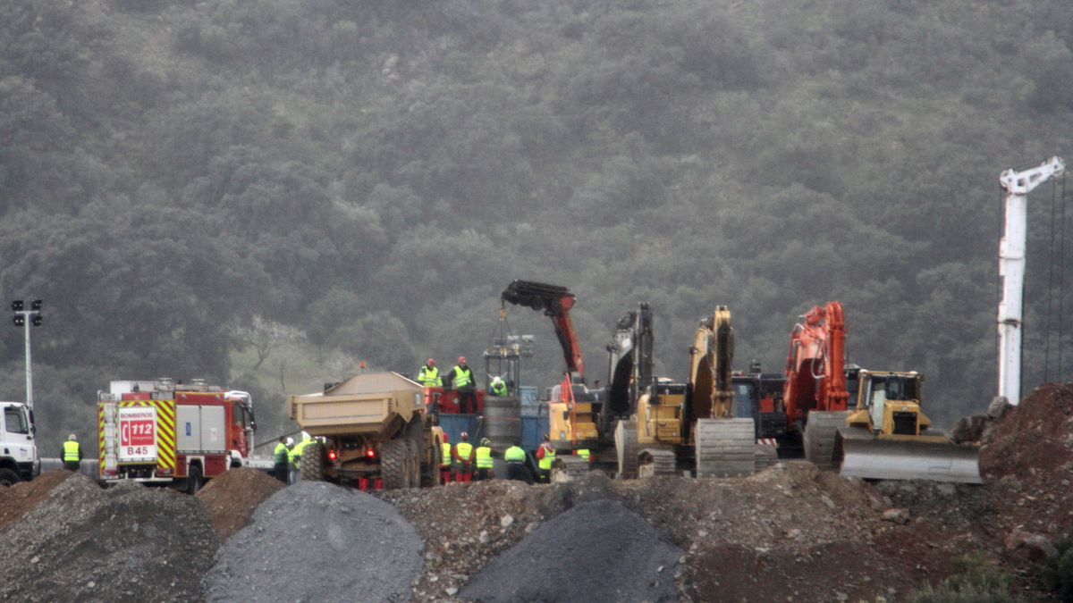 In this photo taken on Sunday, Jan. 20, 2019, drill and excavating machinery work on top of the mountain next to a deep borehole to reach a 2-year-old boy trapped there for six days near the town of Totalan in Malaga, Spain. Spanish officials say rescuers are making slow progress in exceptionally difficult conditions to reach a 2-year-old boy who fell into a narrow, deep borehole in the countryside eight days ago.