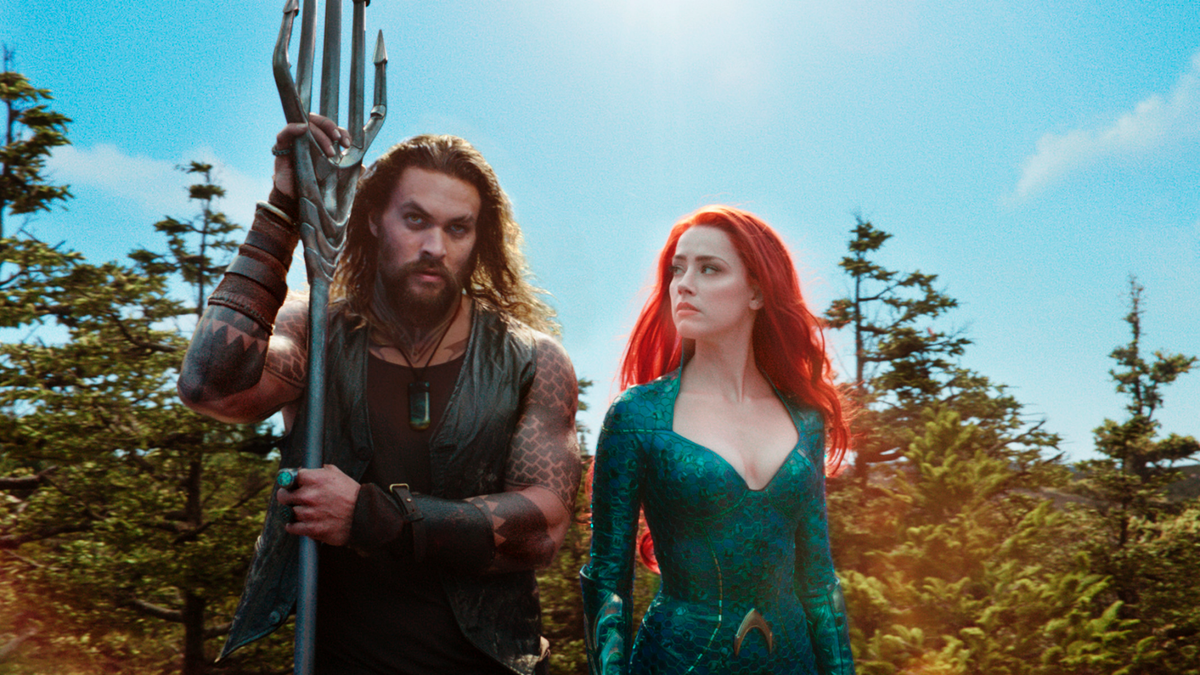 This image released by Warner Bros. Pictures shows Jason Momoa, left, and Amber Heard in a scene from 