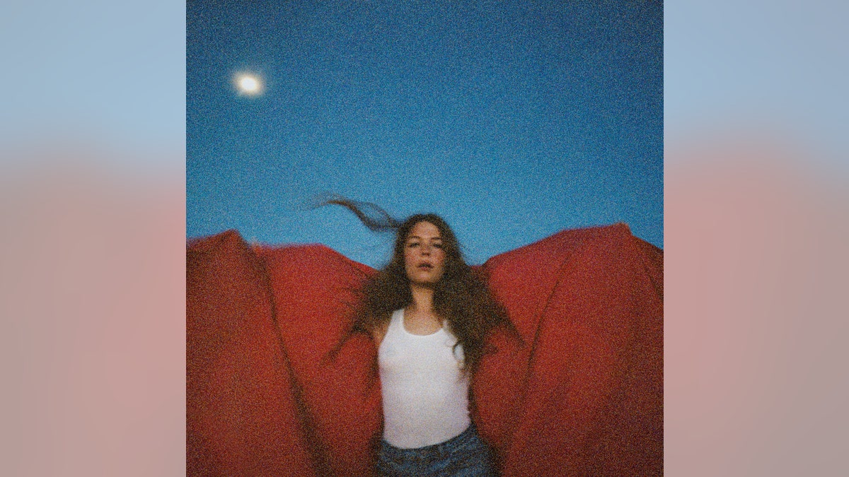 This cover image released by Capitol Records shows "Heard It In A Past Life," by Maggie Rogers, who recently called out inappropriate fans at her concert.