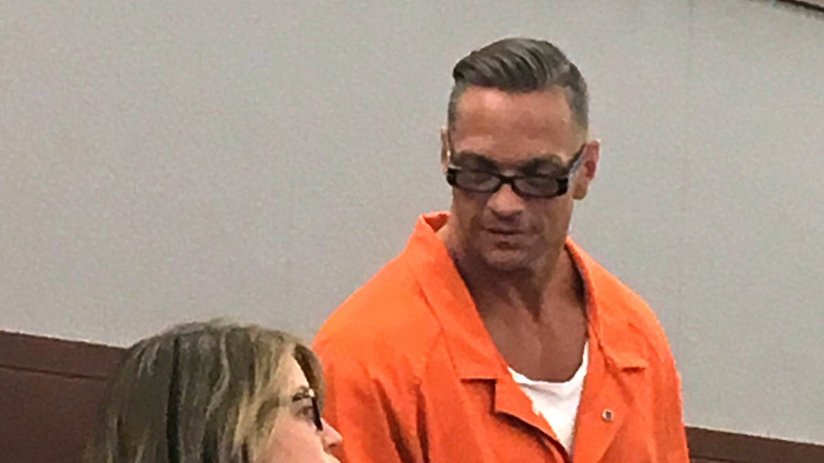 In this Aug. 17, 2017, file photo, Nevada death row inmate Scott Raymond Dozier, right, confers with Lori Teicher, a federal public defender involved in his case, during an appearance in Clark County District Court in Las Vegas. (AP Photo/Ken Ritter, File)