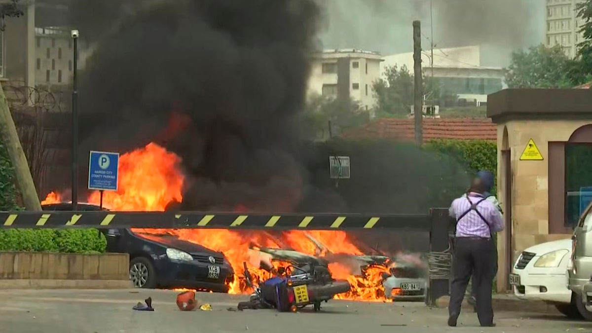 This frame taken from video shows a scene of an explosion in Kenya's capital, Nairobi, on Jan. 15. Gunfire and explosions were reported near an upscale hotel complex. (AP Photo/Josphat Kasire)
