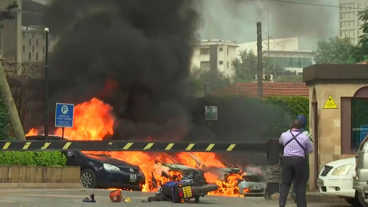 This frame taken from video shows a scene of an explosion in Kenya's capital, Nairobi, on Jan. 15. Gunfire and explosions were reported near an upscale hotel complex. (AP Photo/Josphat Kasire)