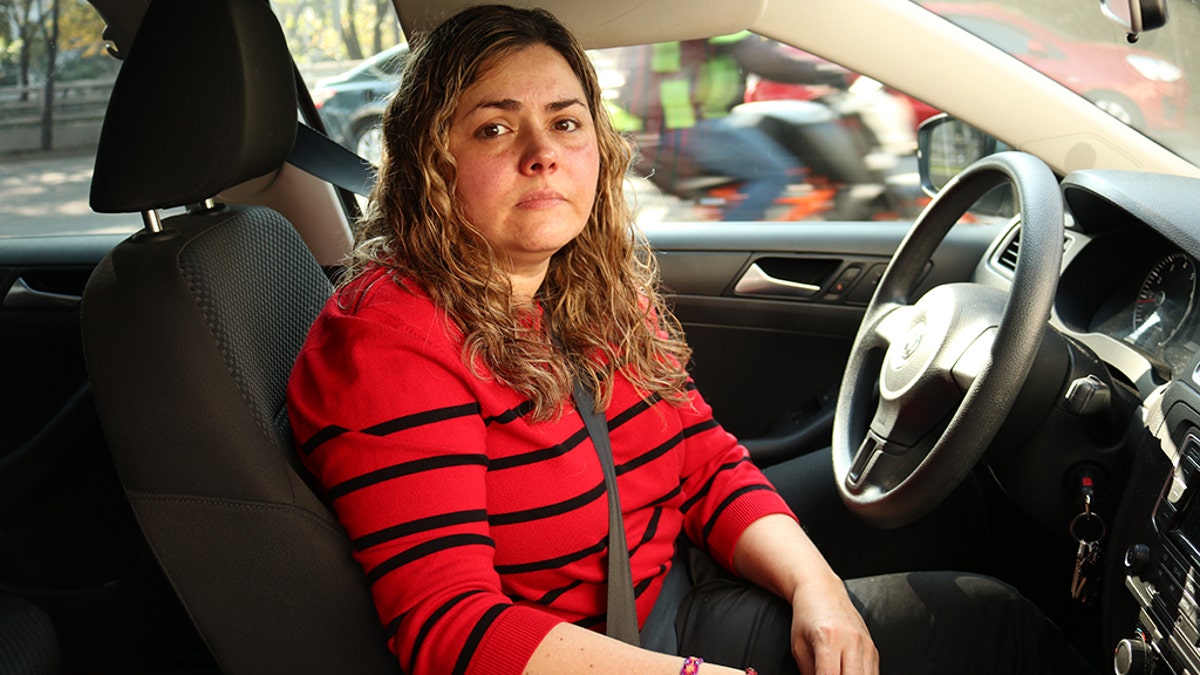Martha Rodriguez waits to fill up in Mexico City