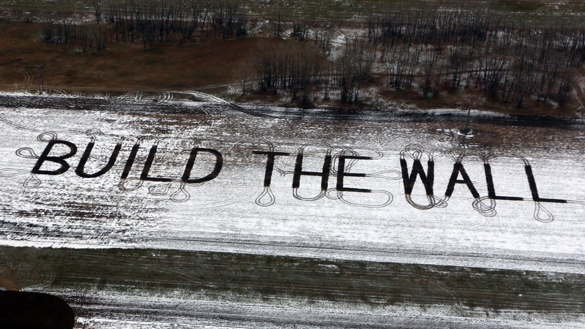Farmer Gene Hanson of Edgeley, North Dakota plowed a message of support for President Trump: "Build the wall."