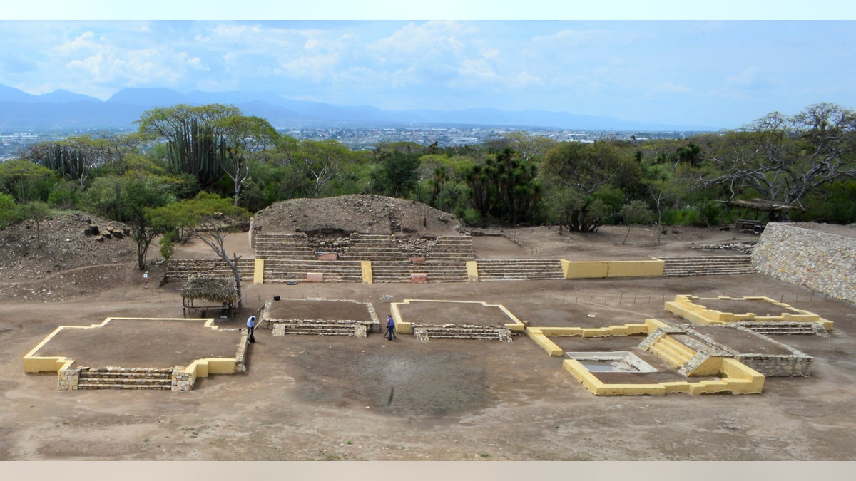 In this 2018 photo provided by Mexico's National Institute of Anthropology and History, INAH, investigators work at the Ndachjian - Tehuacan archaeological site in Tehuacan, Puebla state, Mexico, where archaeologist have identified the first known temple to the Flayed Lord, a pre-Hispanic fertility god depicted as a skinned human corpse. (Meliton Tapia Davila/INAH via AP)