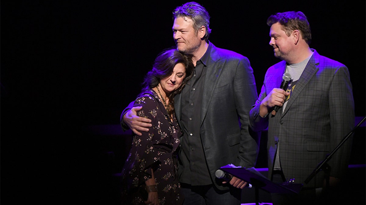 Angie Gentry, Blake Shelton and Storme Warren speak onstage during C'Ya on The Flipside benefit concert, benefitting The Troy Gentry Foundation at The Grand Ole Opry on January 9, 2019 in Nashville. — Getty