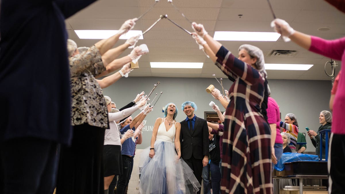 While the reception of 70 people included some dancing, much of it was spent packing meals, Fox 9 reported.