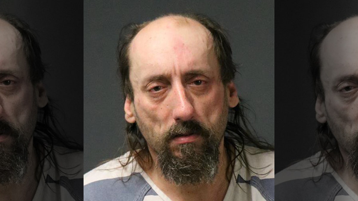 John VanHorn, 49, was charged with false imprisonment for allegedly shackling his wife to his vehicle while he went to work because he was concerned he was cheating on him.