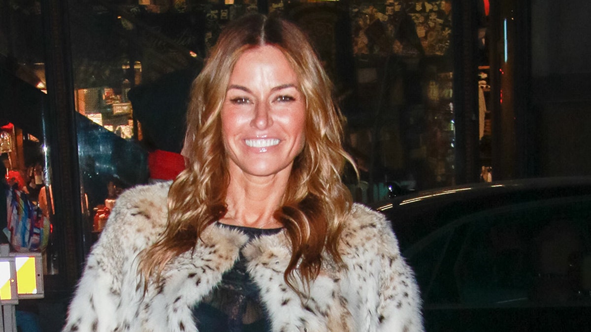 Model Kelly Bensimon 51 shows off her toned legs in all white