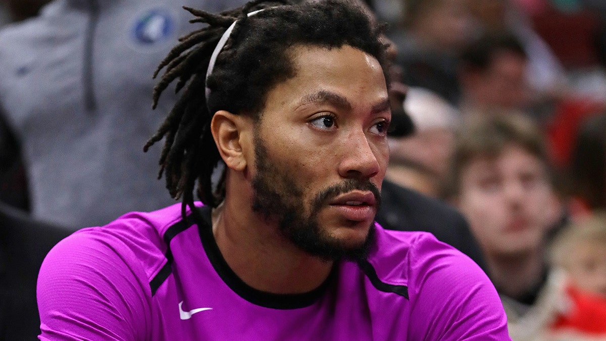 Derrick Rose #25 of the Minnesota Timberwolves watches from the bench as teammates take on the Chicago Bulls at the United Center on December 26, 2018 in Chicago, Illinois.