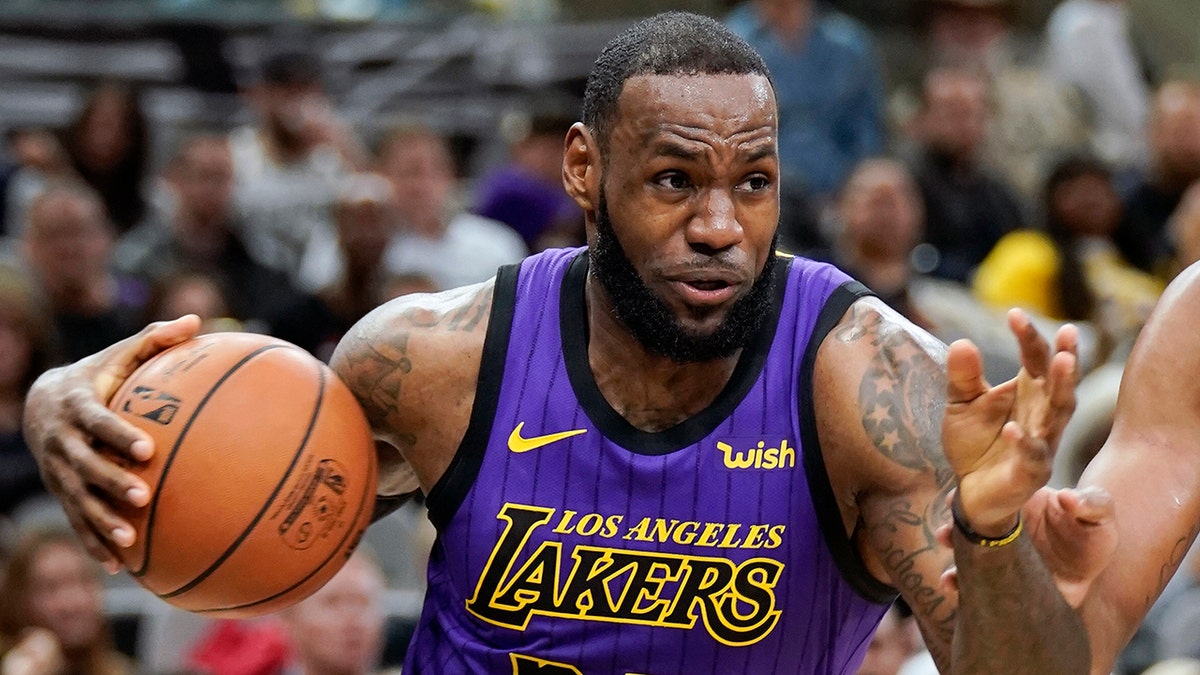 Los Angeles Lakers' LeBron James (23) drives against the San Antonio Spurs during the first half of an NBA basketball game, in San Antonio, Dec. 7, 2018. (Associated Press)