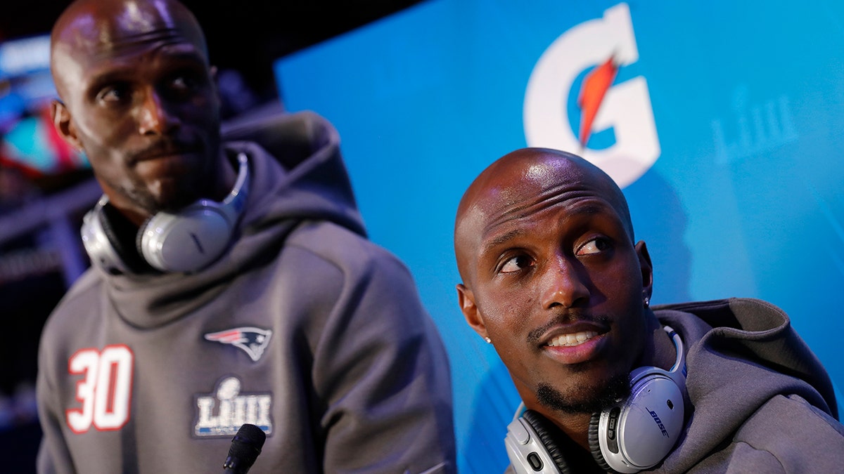 New England Patriots' Jason McCourty and Devin McCourty answer questions during Opening Night for the NFL Super Bowl 53 football game Monday, Jan. 28, 2019, in Atlanta.