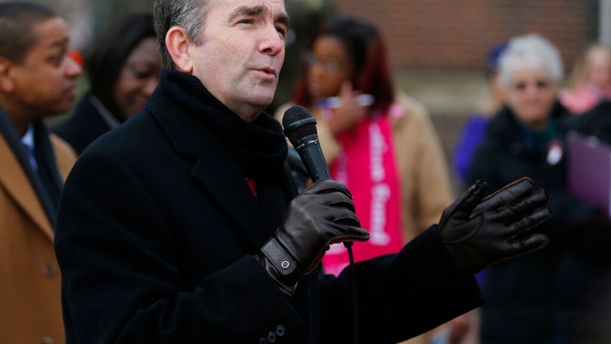 FILE - In this Jan. 14, 2019, file photo, Virginia Gov. Ralph Northam speaks to a crowd during a Women's Rights rally at the Capitol in Richmond, Va. A push by Virginia Democrats to loosen restrictions on late-term abortions is erupting into a fierce partisan clash due to a lawmaker's comments about late-term abortion. Gov. Ralph Northam added gas to the fire Wednesday, Jan. 30, by describing a hypothetical situation where an infant who is severely deformed or unable to survive after birth could be left to die. (AP Photo/Steve Helber, File)