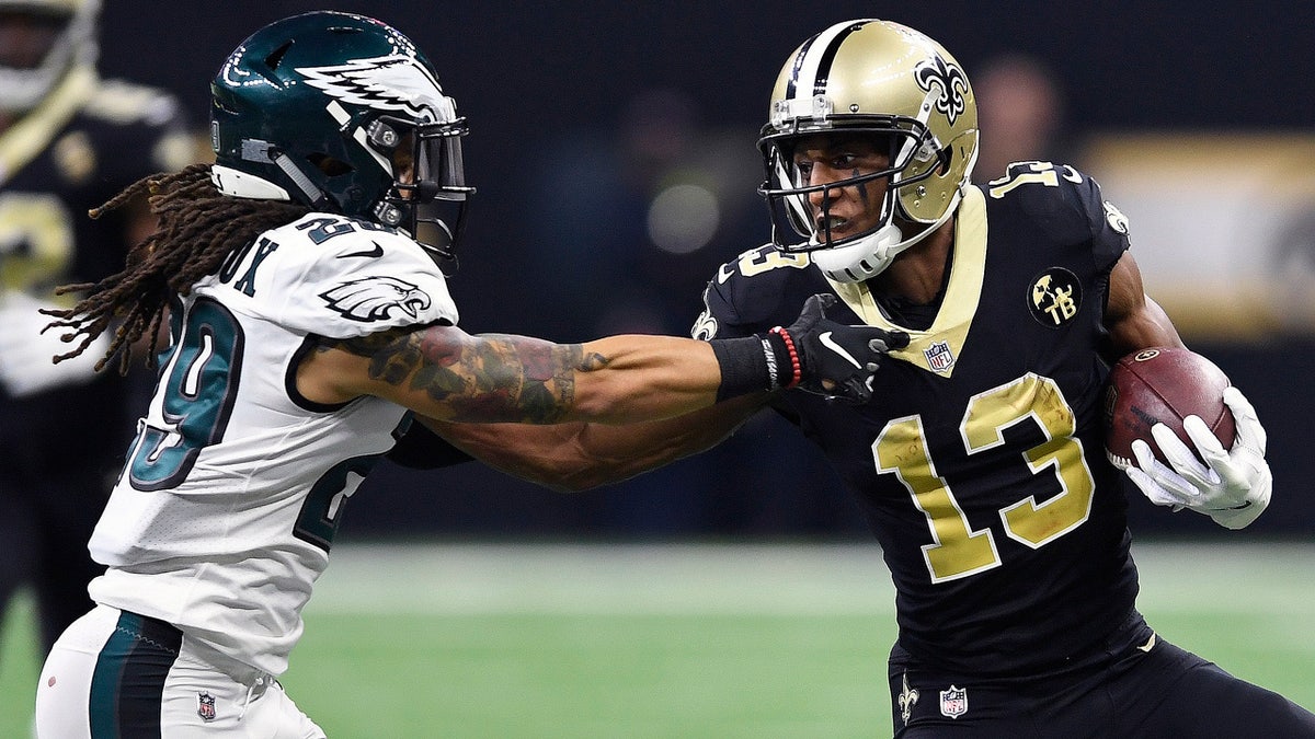 New Orleans Saints wide receiver Michael Thomas (13) carries on a 42-yard reception against Philadelphia Eagles free safety Avonte Maddox (29) in the first half of an NFL divisional playoff football game in New Orleans, Sunday, Jan. 13, 2019. (AP Photo/Bill Feig)