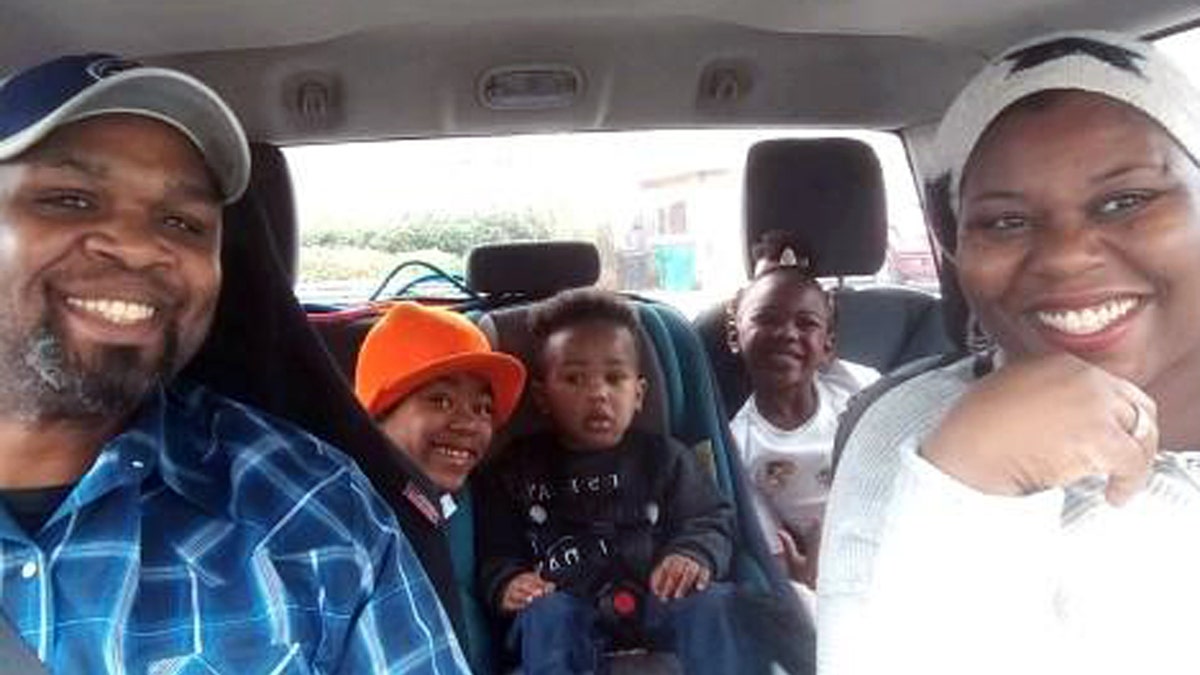The Shaw family in their car.