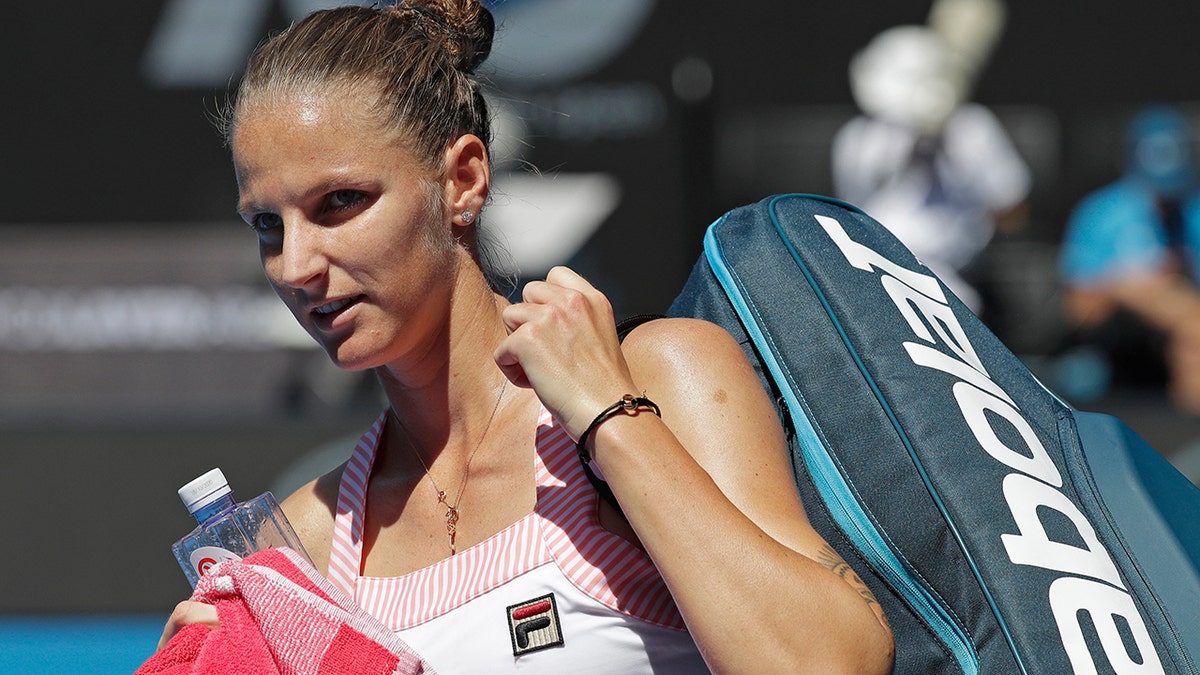 Karolina Pliskova of the Czech Republic leaves Rod Laver Arena after defeating United States' Serena Williams in their quarterfinal match at the Australian Open tennis championships in Melbourne, Australia, Wednesday, Jan. 23, 2019.