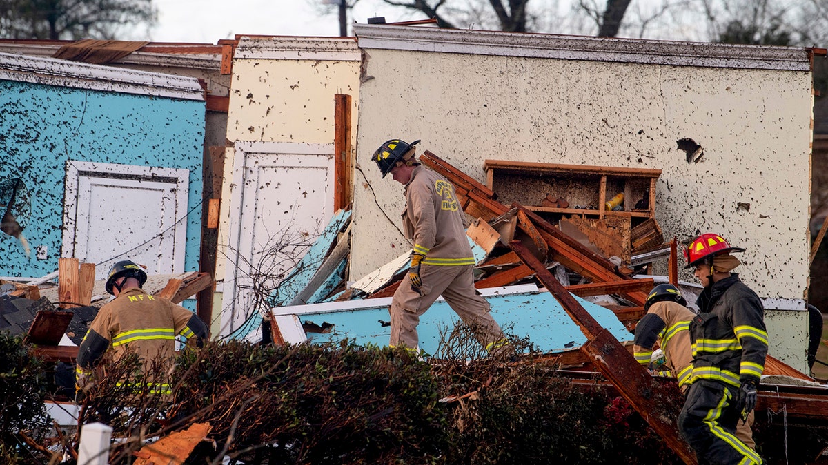 Rescue Workers search through damage after a tornado touchdown in Wetumpka, Ala., on Saturday, Jan. 19, 2019.