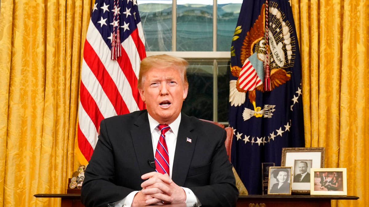 President Donald Trump speaks from the Oval Office of the White House as he gives a prime-time address about border security Tuesday, Jan. 8, 2018, in Washington. (Carlos Barria/Pool Photo via AP)