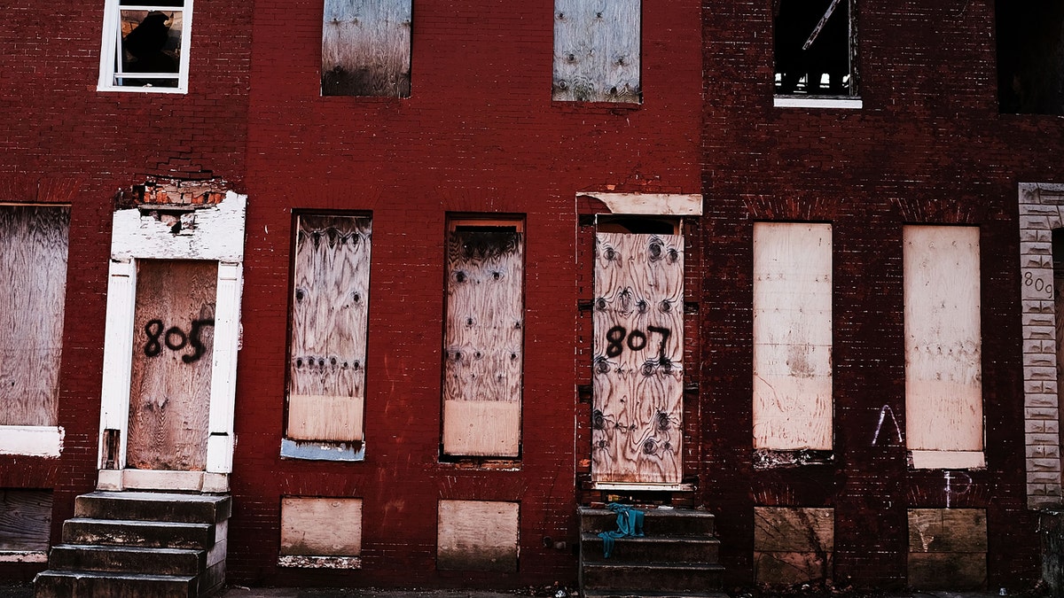 BALTIMORE, MD - FEBRUARY 03: Abandoned buildings stand in a neighborhood with a high murder rate on February 3, 2018 in Baltimore, Maryland. 