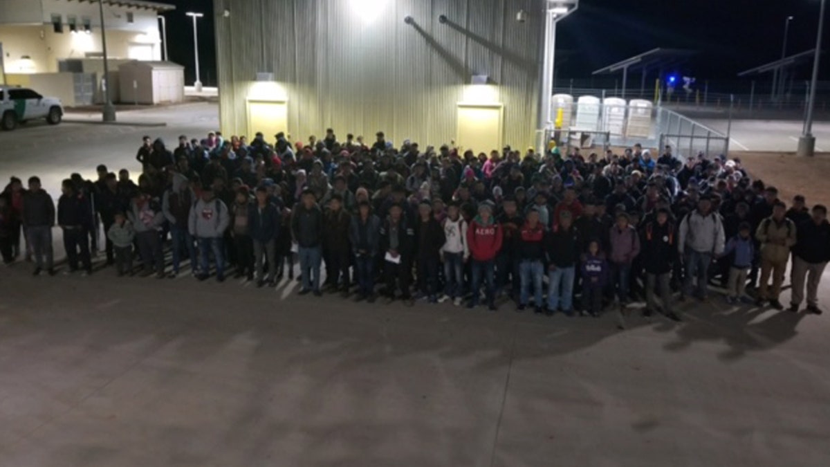 United States Border Patrol agents in New Mexico encountering a large group of immigrants.