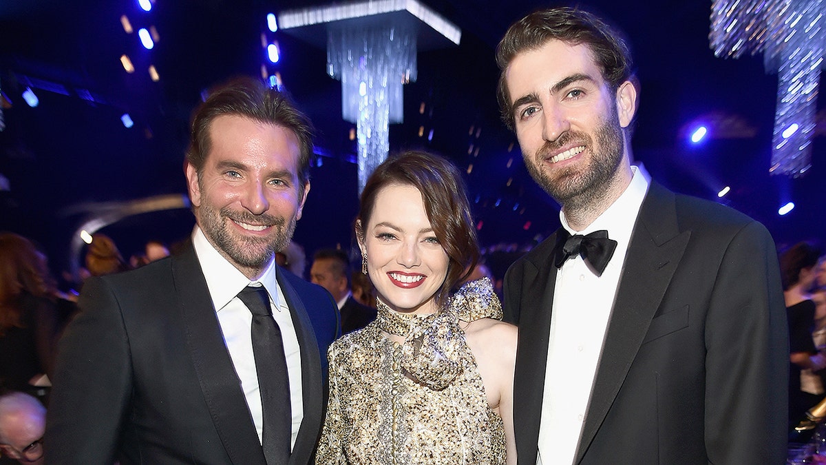 LOS ANGELES, CA - JANUARY 27:  (L-R) Bradley Cooper, Emma Stone, and Dave McCary during the 25th Annual Screen Actors Guild Awards at The Shrine Auditorium on January 27, 2019 in Los Angeles, California. 480595  (Photo by Dimitrios Kambouris/Getty Images for Turner)