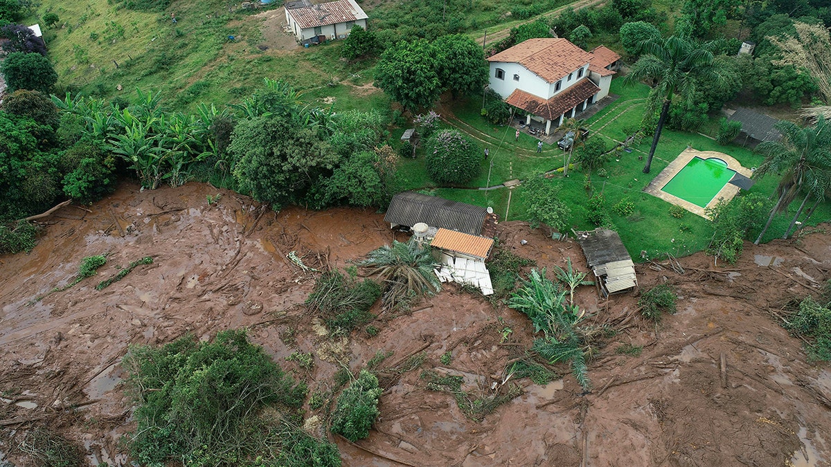 An aerial view shows a partially destroyed house after a dam collapsed, in Brumadinho, Brazil, Saturday, Jan. 26, 2019. (Associated Press)